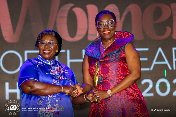 Mrs Frema Osei-Opare, Chief Of Staff (left), presenting a plaque to Mrs Ursula Owusu-Ekuful